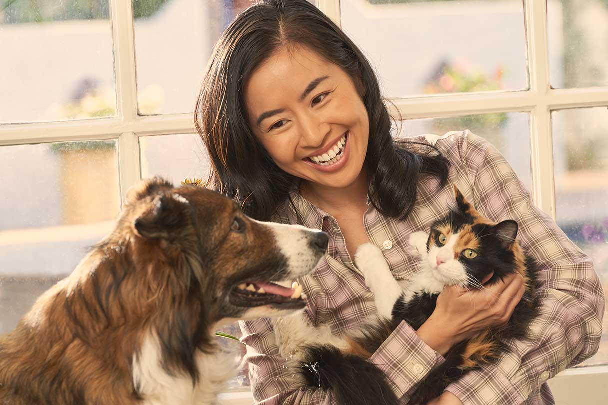 Happy family with dog and cat - Pet Insurance